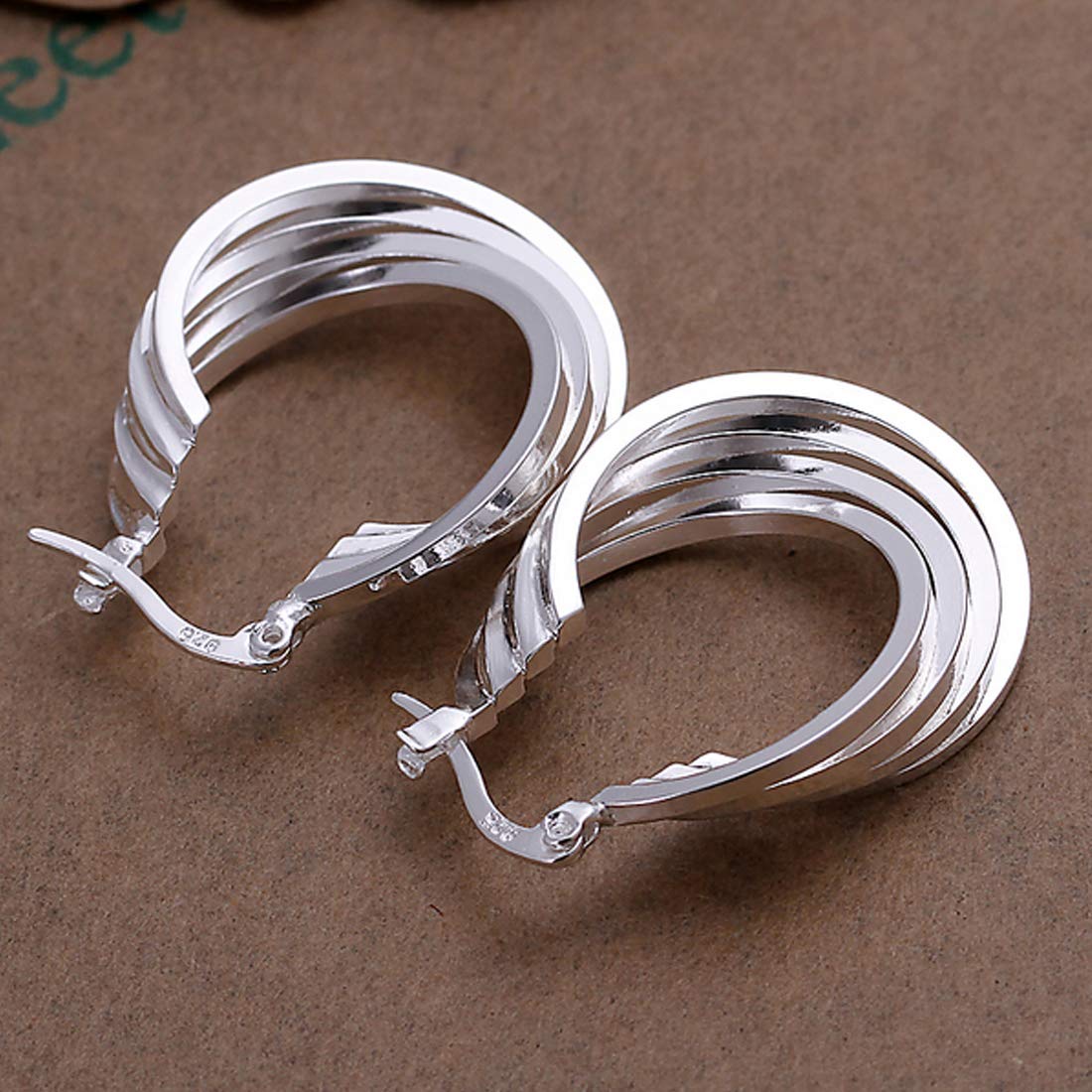 Yellow Chimes entangled rings earrings - stylish party look